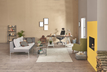 Decorative modern home office interior. Brown and yellow stone wall detail with fireplace. Wooden working table and grey sofa with green armchair furniture. new style home office planning.