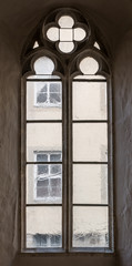 Fototapeta na wymiar The old and ancient window in dark room