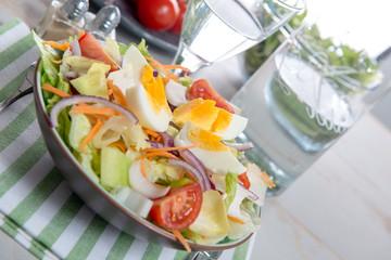 plate of vegetable salad on green towel