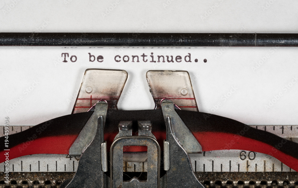 Fototapete macro detail of to be continued on electric typewriter with ribbon