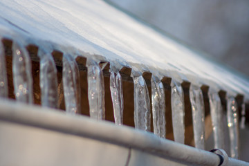 Icicles falling into the roof of the gutter