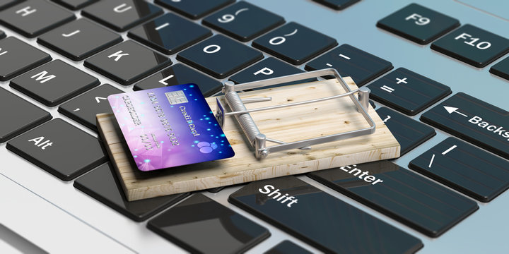 Credit card on a mouse trap, computer keyboard background. 3d illustration