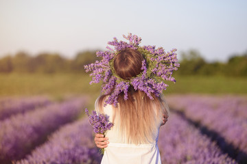 Young, beautiful girl in lavender field
