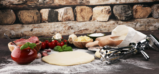 Fresh original Italian raw pizza preparation with fresh ingredients