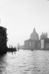 Fototapeta na wymiar Buildings in Venice along the Grand Canal in the Morning with fog.