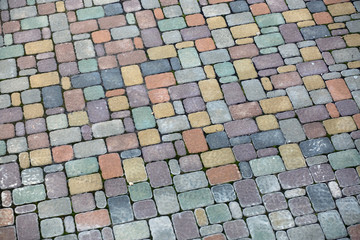 Fototapeta premium Multicolored paving slabs. Pavement background. Cobblestone texture.