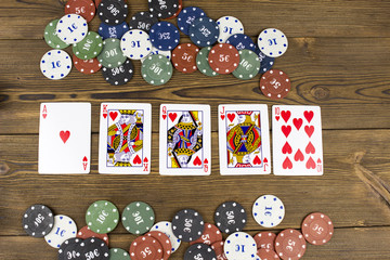 .Cards and chips on a wooden background
