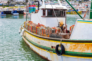 Crayfish Crab boat floating in Kalk Bay Harbour, Cape Town © Sunshine Seeds