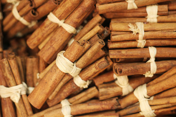 bunches of cinnamon sticks, bound together with string