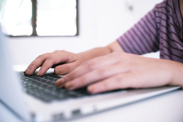 The Casual business woman works online on laptop which hand on keyboard in her house Isolated screen.