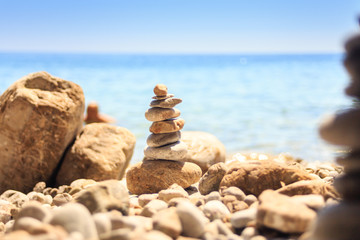 stone tower made of pebbles on the beach