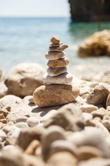 stone tower made of pebbles on the beach