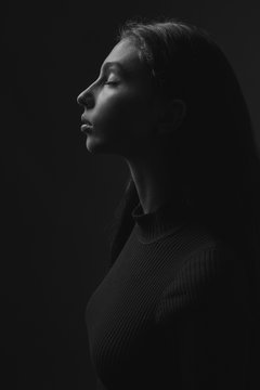 Young woman in profile. Black and white