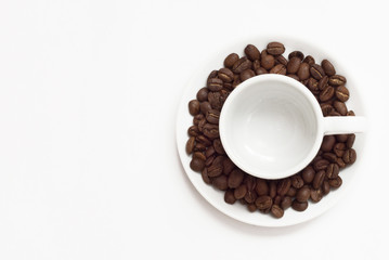 Empty cup  with coffee beans. Isolated on a white background. Place for the text.