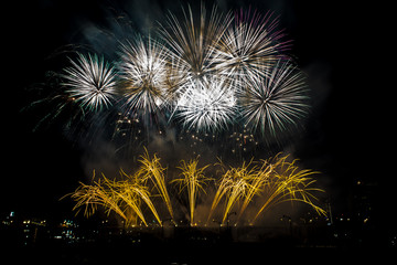 Fireworks marks the end of centennial celebration on the shores of Mississippi river  in downtown...