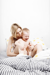 mom with a little son wake up in the morning. Morning waking mother and baby. Embrace.