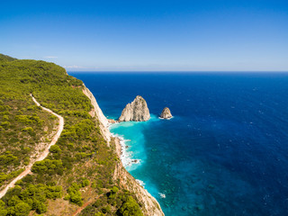 Greek biggest national flag waving in the sky in Keri in Zakynthos (Zante) island in Greece