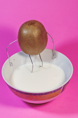 kiwi with arms and legs like a person, different view of a kiwi, surrealism kiwi