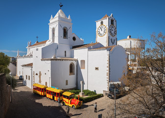 Stopping the tourist train near the church of St. Maria in Tavira, Algarve, Portugal