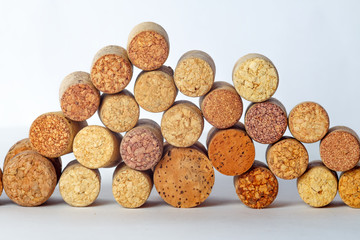 wine corks flocked at random heights on a white background.
