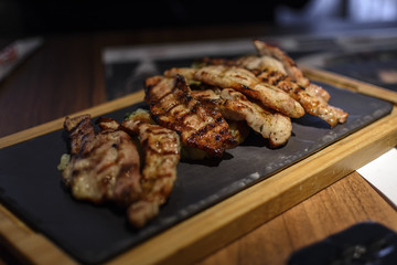 Slice of pork meat cooked in bbq.
