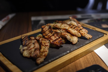 Slice of pork meat cooked in bbq.