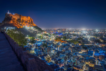 Blue city and Mehrangarh fort on the hill at night in Jodhpur, Rajasthan, India