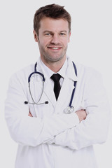 Fototapeta premium Portrait of confident medical doctor on white background