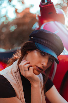 Young pretty woman at scooter