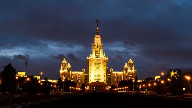 Moscow, Russia. Time-lapse of illuminated Lomonosov Moscow State University at night. Popular landmark in Russia. Time-lapse with car trails and dark fast pacing sunset sky