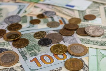 Euro dollars money. Euro coins are dollars. Euro-dollar currency. The concept of money. Bills are stacked on each other in different positions with coins.