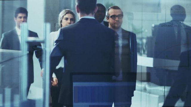 Multicultural Crowd of Business People Walking Through the Hallway of the Corporate Building