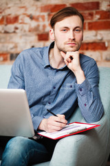 Young man with a laptop