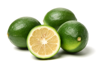 multiple limes on white background