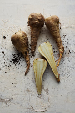 Isolated fresh organic parsnip vegetables against white background