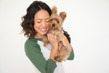 Happy Pretty Woman Embracing Yorkshire Terrier