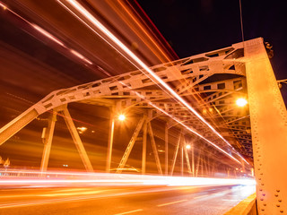 Fototapeta na wymiar city traffic on Krung Thep bridge at night.Krung Thep bridge is located in Bangkok