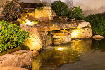 Brightly Lit Waterfall and Pond