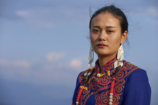 Beautiful Chinese Yi people in traditional costumes  outdoor