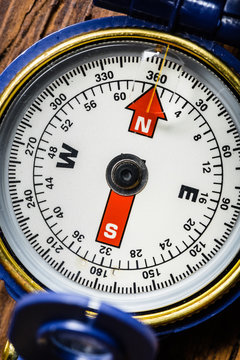 Compass on Wooden Background