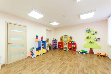 Fototapeta premium Light pink colored game room in the kindergarten