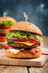 Delicious fresh homemade burger on a wooden table