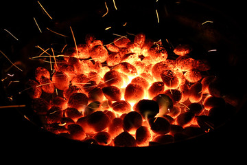grill with sparks and briquettes