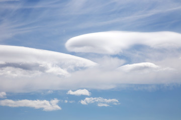 White clouds in the blue sky.