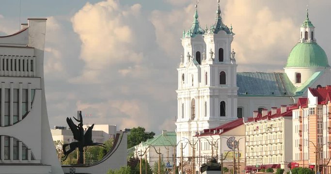 Grodno, Belarus. Grodno Regional Drama Theatre, St. Francis Xavier Cathedral And Traffic In Mostowaja And Kirova Streets In Summer Day