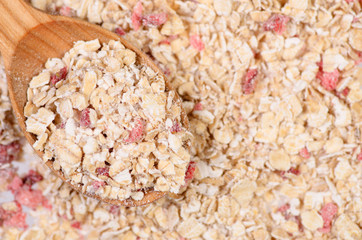 Porridge oat flakes with strawberries wooden spoon