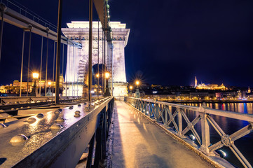 Fototapeta na wymiar Night view of illuminated Budapest with Danube river, palace and chain bridge, Hungary.