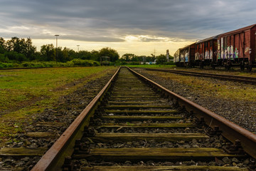 Fototapeta na wymiar dramatic sunset over railroad