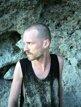 Young man on sandy beach