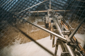 Automated process of mixing and fermentation of beer inside huge steel tank or vat at brewery...